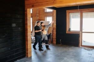 worker and contractor holding Ipad and pointing