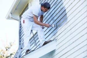 man painting exterior