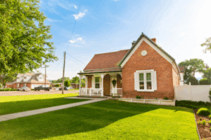 Brick home with professional landscaping and excellent curb appeal in residential neighborhood
