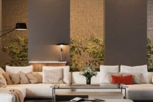 Modern living room with neutral tones, textured walls, and natural greenery accents.