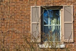traditional windows with wooden shutters